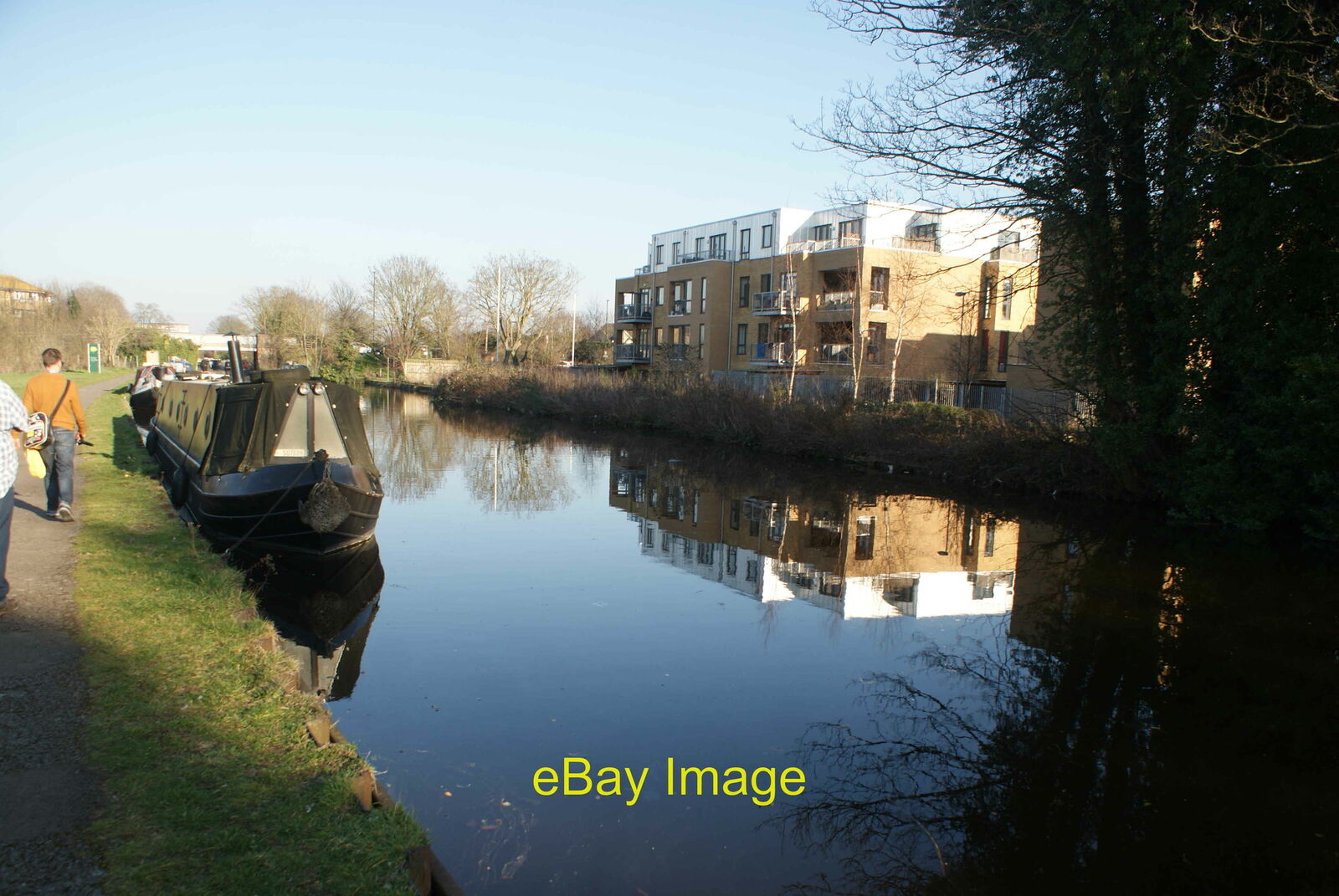 Photo 12x8 View of a narrowboat and block of flats reflected in the Grand  c2019