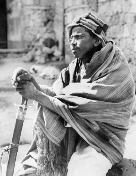 Young bedouin \'spy\' in Jiddah leans on his sword as he keeps watch Old Photo