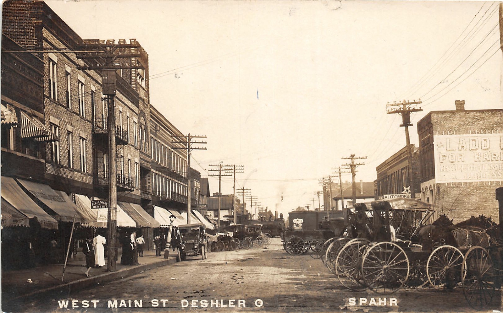 DC1/ Deshler Ohio RPPC Postcard c1910 West Main Street Stores Wagons 5
