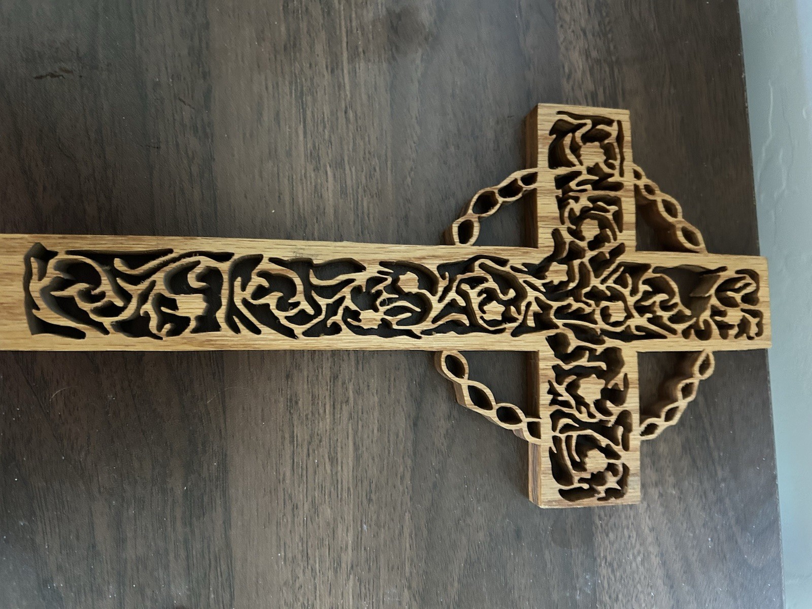 Celtic wooden cross with Intricate Cutout Design.