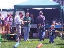 Photo 12x8 Tring Carnival - the ferrets prepare Amongst the many stalls a c2012 picture