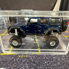 Jeep Wrangler Unlimited 4-Door Lifted Off-Road Diecast Model 1:64 Blue picture