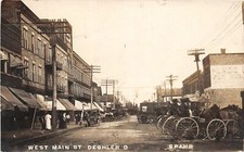 DC1/ Deshler Ohio RPPC Postcard c1910 West Main Street Stores Wagons 5 picture